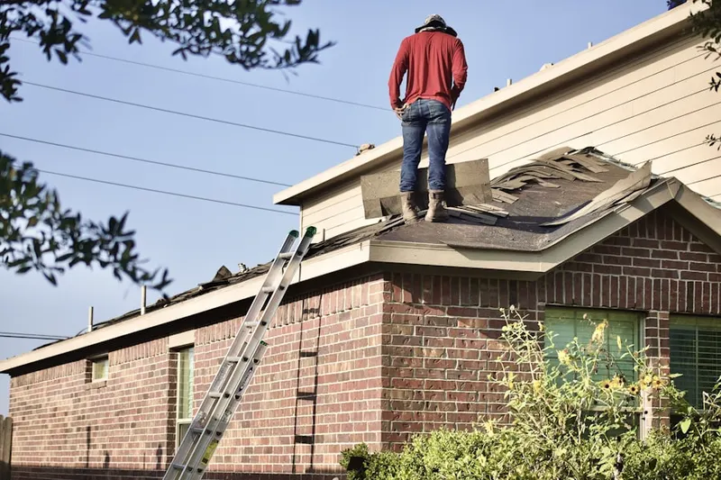 Professional roofer working on a residential roof in Holiday Harbors